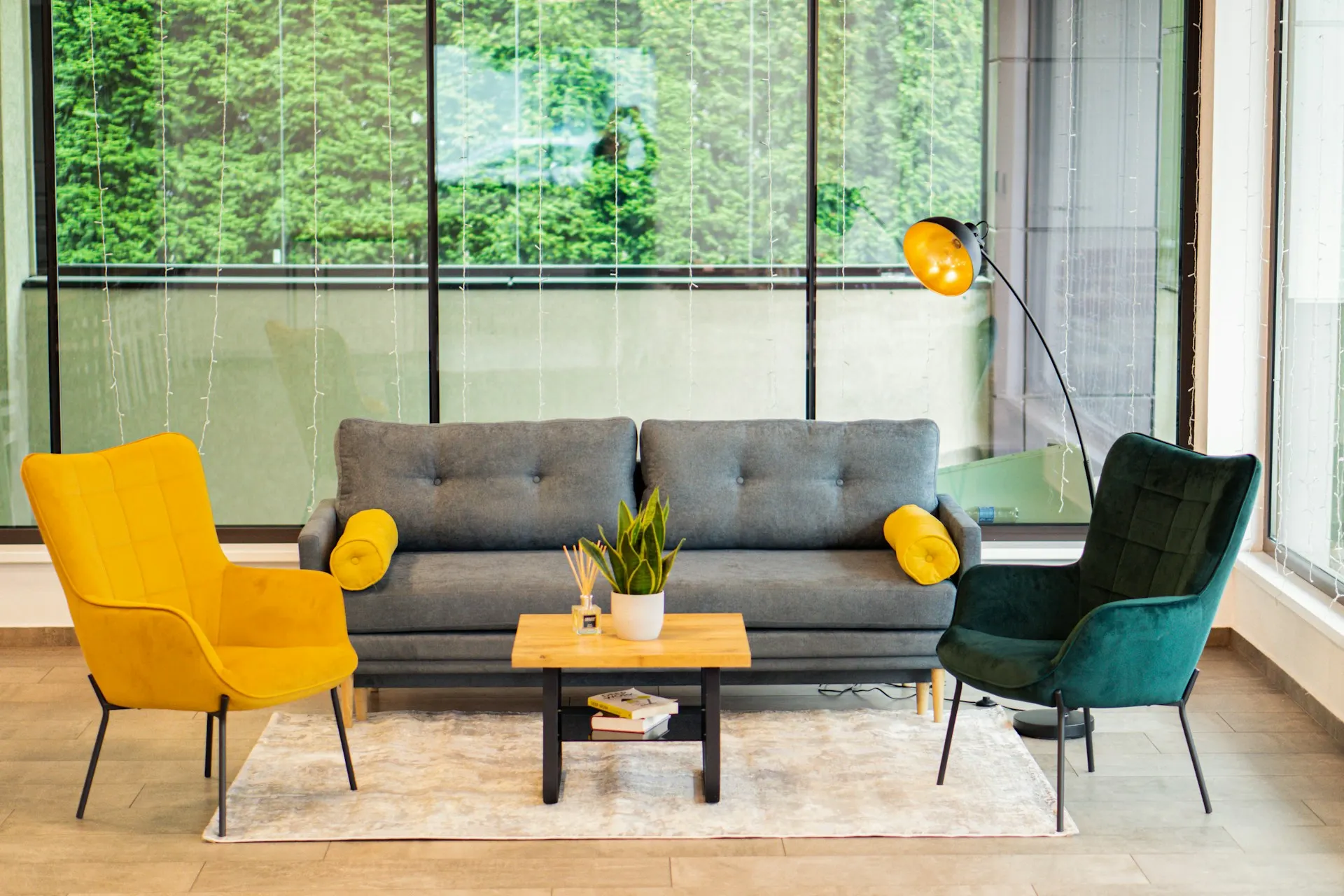 A bright waiting area with a sofa and two armchairs